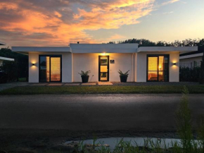 Luxury villa with veranda screen SUPs and canoe